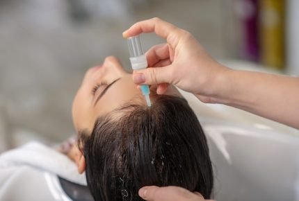 hair-care-hair-stylist-applying-keratin-her-clients-hair_259150-17251